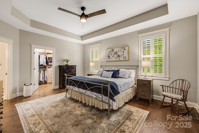 75 Balsam High Rd, Biltmore Lake, NC 28715 - bedroom featuring a raised ceiling, wood finished floors, multiple windows, and baseboards
