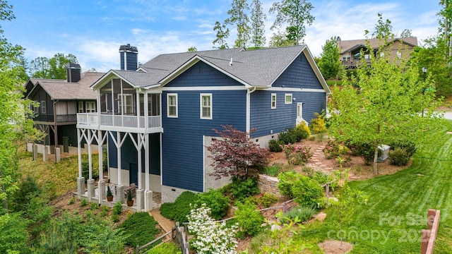 75 Balsam High Rd, Biltmore Lake, NC 28715 - back of house with a chimney and a sunroom
