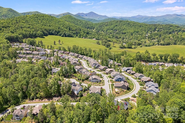 75 Balsam High Rd, Biltmore Lake, NC 28715 - aerial overview of property's location with a forest, nearby suburban area, and mountains