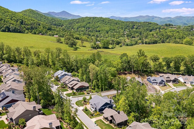 75 Balsam High Rd, Biltmore Lake, NC 28715 - aerial perspective of suburban area featuring a mountain backdrop and a heavily wooded area