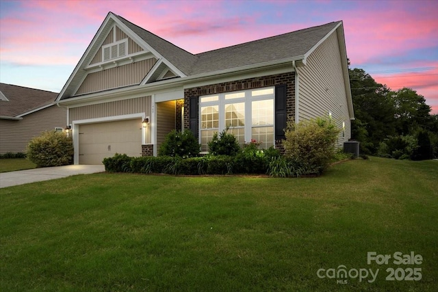 1409 Tupelo Rd, Clover, SC 29710 - view of front facade featuring a front lawn, driveway, central AC, a garage, and a shingled roof