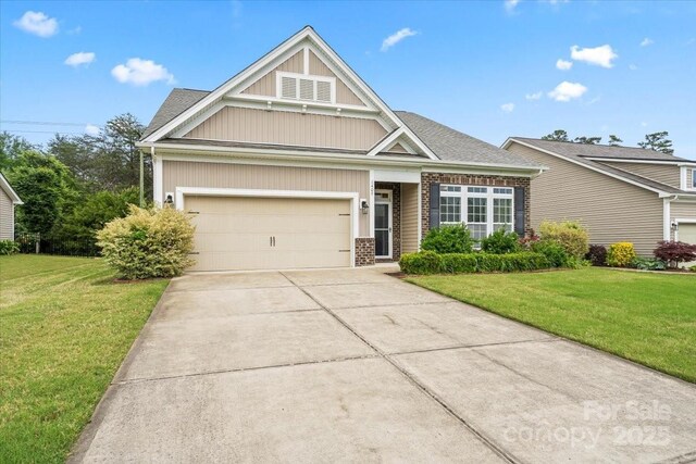 1409 Tupelo Rd, Clover, SC 29710 - craftsman-style home with driveway, a front lawn, brick siding, and board and batten siding