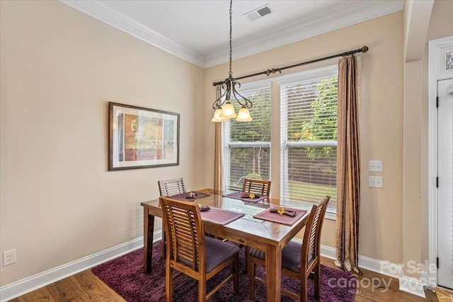 1409 Tupelo Rd, Clover, SC 29710 - dining area with crown molding, wood finished floors, and baseboards