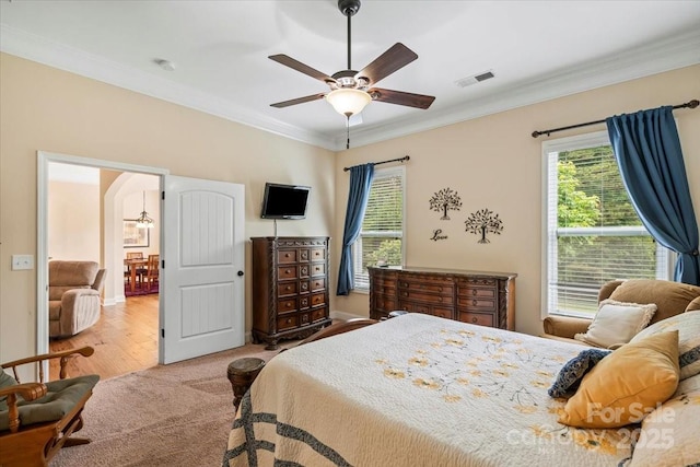 1409 Tupelo Rd, Clover, SC 29710 - bedroom with ornamental molding, arched walkways, baseboards, a ceiling fan, and carpet