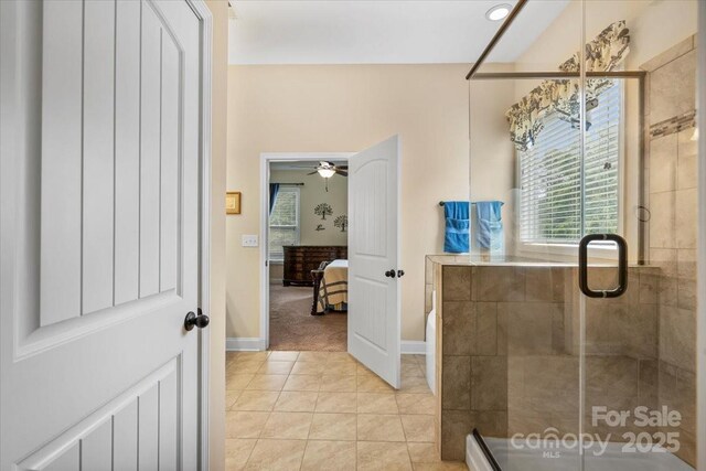 1409 Tupelo Rd, Clover, SC 29710 - full bath featuring a shower stall, ensuite bathroom, baseboards, a ceiling fan, and tile patterned floors