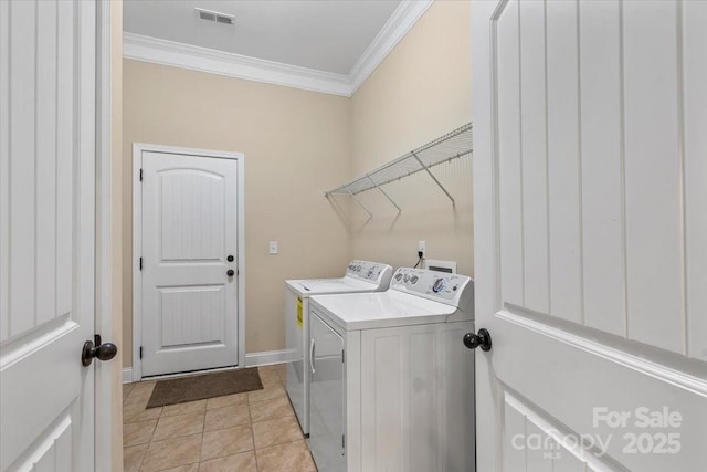1409 Tupelo Rd, Clover, SC 29710 - clothes washing area with independent washer and dryer, ornamental molding, baseboards, and light tile patterned floors