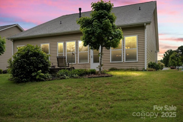 1409 Tupelo Rd, Clover, SC 29710 - rear view of house with a yard and a shingled roof