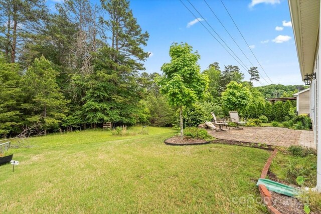 1409 Tupelo Rd, Clover, SC 29710 - view of grassy yard with a patio area