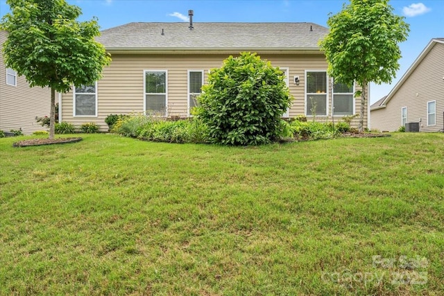 1409 Tupelo Rd, Clover, SC 29710 - back of house featuring a yard and central AC
