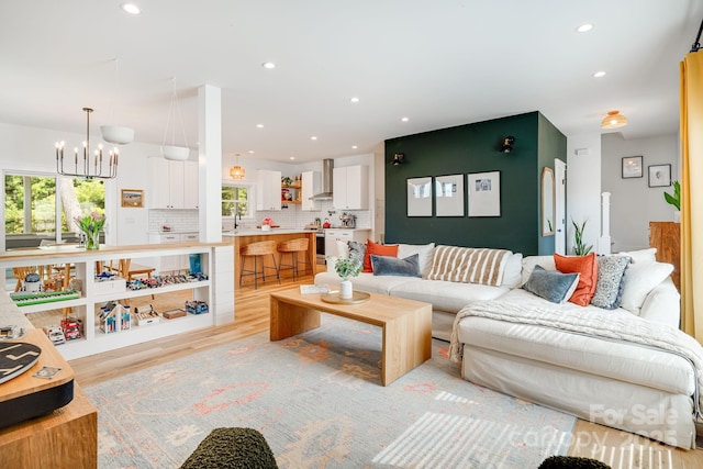 304 Magnolia Ridge Rd, Swannanoa, NC 28778 - living room featuring a chandelier, plenty of natural light, light wood-style flooring, and recessed lighting