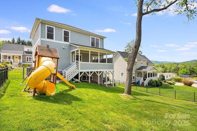 304 Magnolia Ridge Rd, Swannanoa, NC 28778 - rear view of property with a sunroom, a playground, and a garage