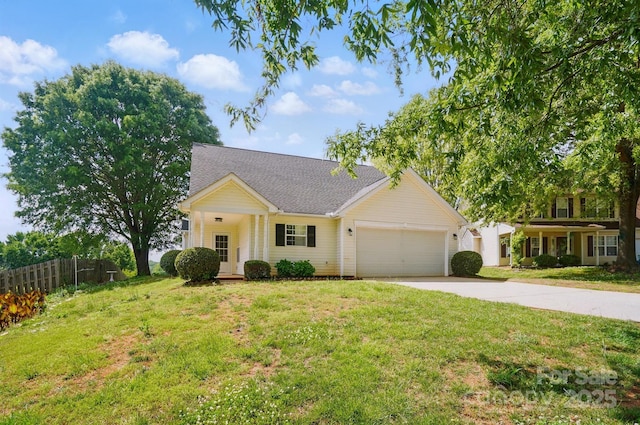 view of front of house with a garage, concrete driveway, and a shingled roof
