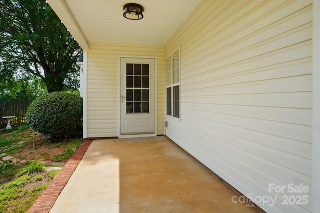 property entrance with a patio area
