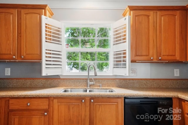 kitchen featuring dishwasher, a sink, light countertops, and brown cabinetry