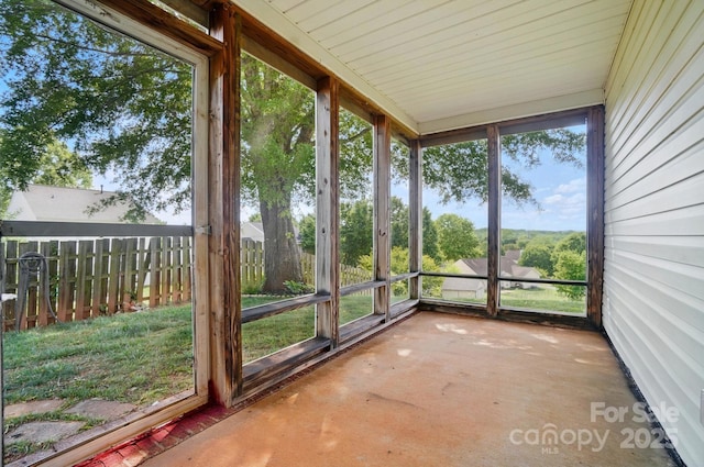 unfurnished sunroom with healthy amount of natural light
