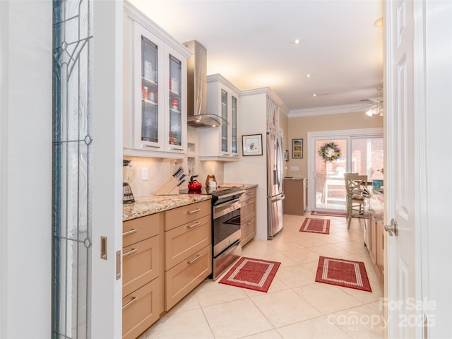 kitchen featuring appliances with stainless steel finishes, wall chimney exhaust hood, decorative backsplash, ornamental molding, and light stone countertops