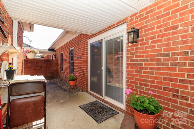 view of patio featuring fence