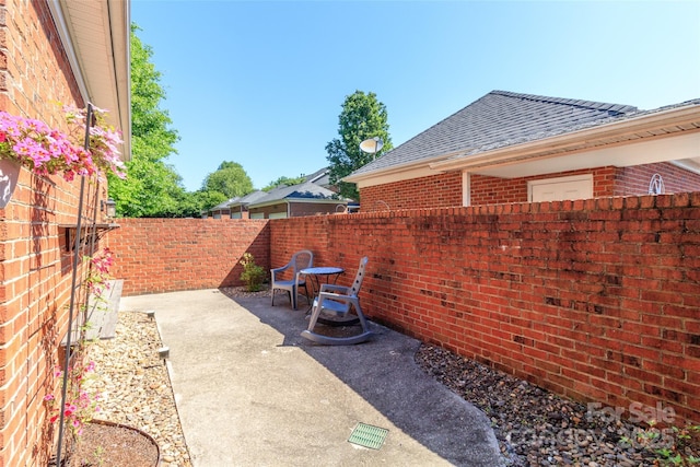 fenced backyard featuring a patio area