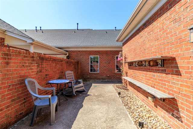 view of patio / terrace featuring fence