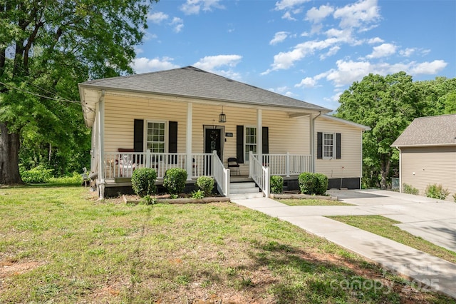 1406 W Walnut Ave, Gastonia, NC 28052 - bungalow-style home featuring covered porch, a front yard, and concrete driveway