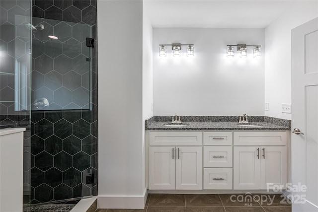15 Myrtle Lee Cv, Arden, NC 28704 - bathroom featuring tiled shower and double vanity