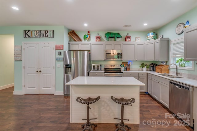 210 Holmes Dr, Spartanburg, SC 29303 - kitchen with stainless steel appliances, light countertops, recessed lighting, and dark wood-style flooring