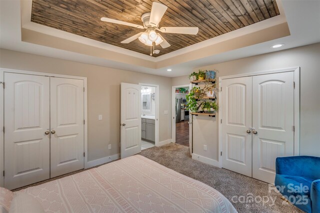 210 Holmes Dr, Spartanburg, SC 29303 - bedroom featuring a tray ceiling, wooden ceiling, recessed lighting, light colored carpet, and a ceiling fan
