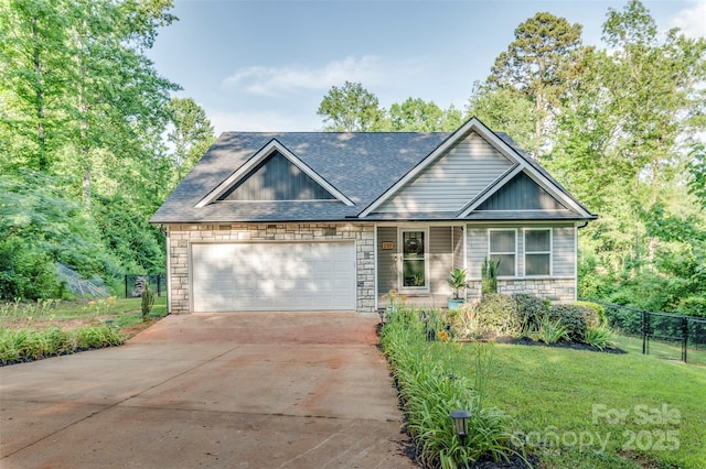210 Holmes Dr, Spartanburg, SC 29303 - view of front facade with stone siding, concrete driveway, a garage, and a shingled roof