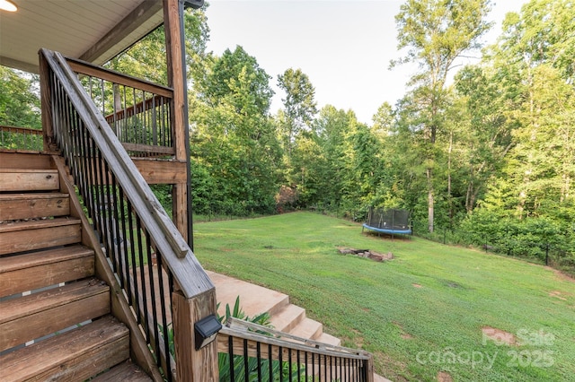 210 Holmes Dr, Spartanburg, SC 29303 - view of grassy yard featuring a trampoline and stairs