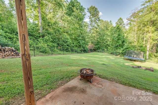 210 Holmes Dr, Spartanburg, SC 29303 - view of yard featuring a trampoline and a fire pit