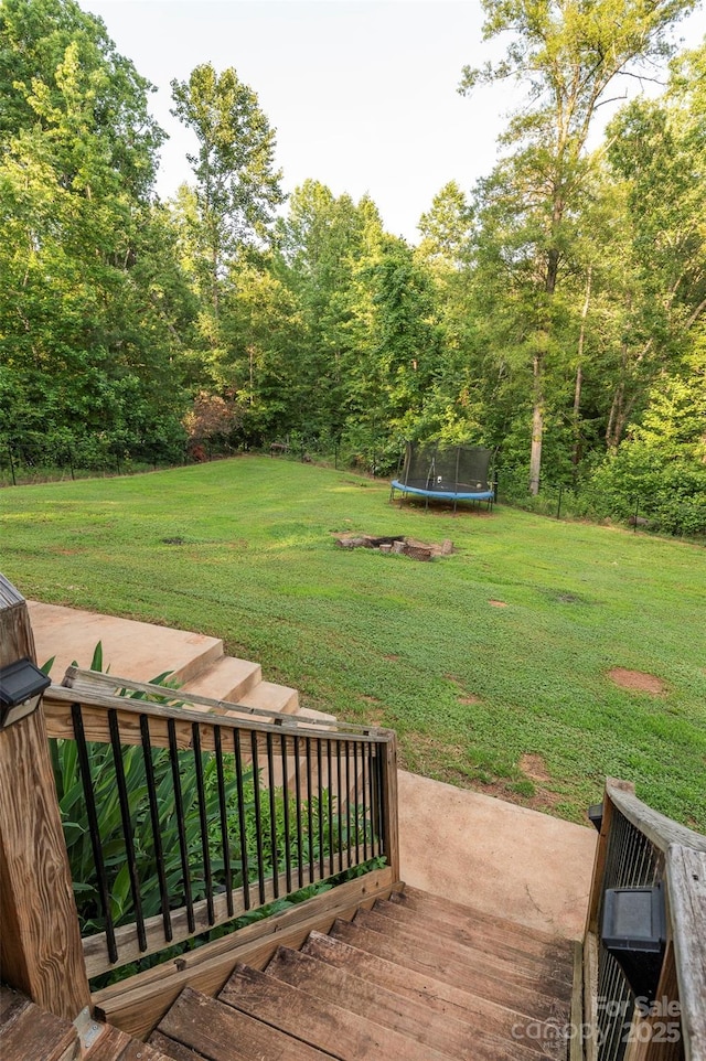 210 Holmes Dr, Spartanburg, SC 29303 - view of green lawn featuring a trampoline
