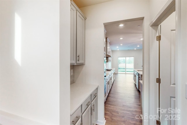 hallway with recessed lighting and wood finished floors