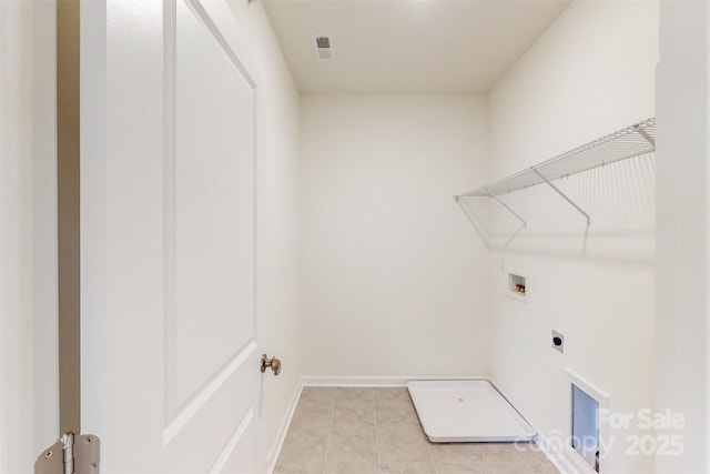 laundry area featuring baseboards, light tile patterned flooring, visible vents, washer hookup, and laundry area