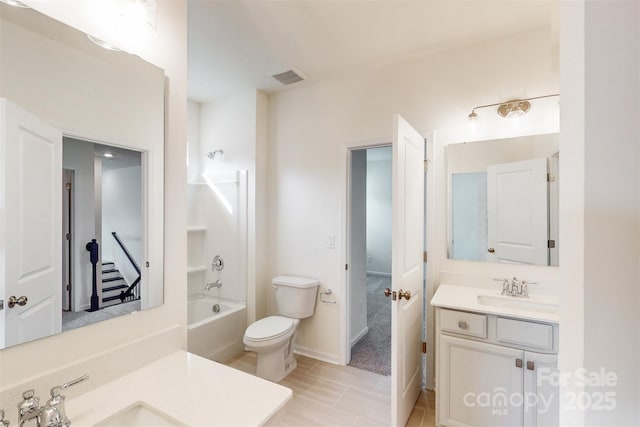 bathroom featuring toilet, bathing tub / shower combination, visible vents, tile patterned flooring, and vanity