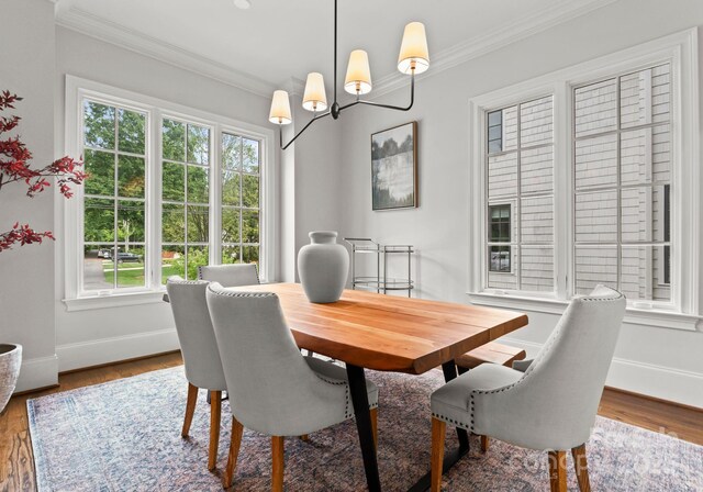 400 Hunter Ln, Charlotte, NC 28211 - dining room featuring ornamental molding, baseboards, wood finished floors, and a chandelier
