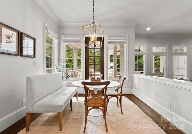 400 Hunter Ln, Charlotte, NC 28211 - dining area with a chandelier, baseboards, wood finished floors, ornamental molding, and recessed lighting