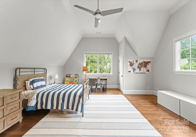 400 Hunter Ln, Charlotte, NC 28211 - bedroom with multiple windows, wood finished floors, lofted ceiling, baseboards, and ceiling fan