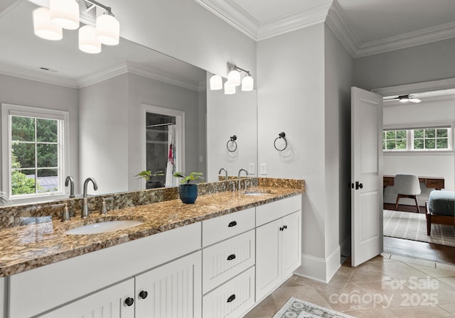 400 Hunter Ln, Charlotte, NC 28211 - full bath featuring baseboards, double vanity, ornamental molding, tile patterned floors, and ensuite bathroom