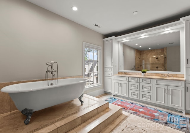 400 Hunter Ln, Charlotte, NC 28211 - full bathroom featuring a stall shower, double vanity, a soaking tub, recessed lighting, and tile patterned floors