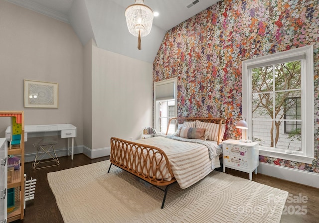400 Hunter Ln, Charlotte, NC 28211 - bedroom with baseboards, multiple windows, vaulted ceiling, wood finished floors, and a chandelier
