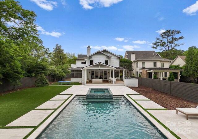 400 Hunter Ln, Charlotte, NC 28211 - rear view of house featuring a chimney, a pergola, an outdoor living space, and a patio area