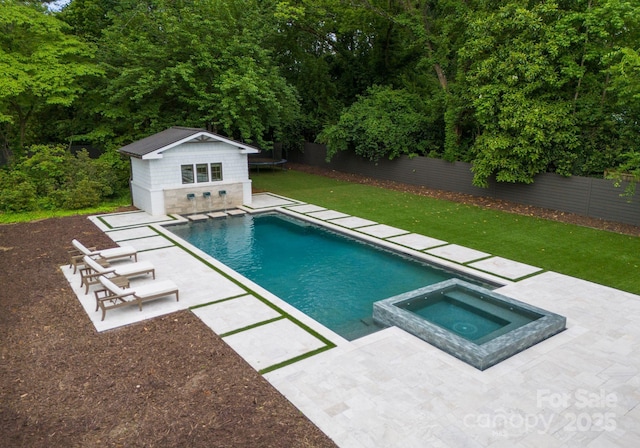 400 Hunter Ln, Charlotte, NC 28211 - view of swimming pool with a trampoline, an outbuilding, a patio area, and a pool with connected hot tub