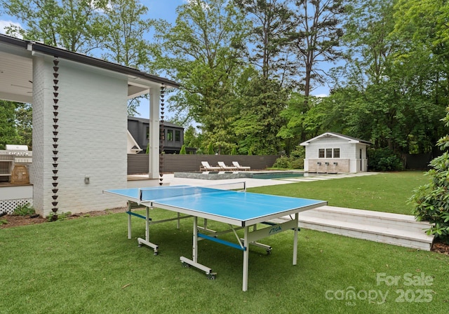 400 Hunter Ln, Charlotte, NC 28211 - view of yard featuring an outbuilding, an outdoor pool, a storage structure, and a patio