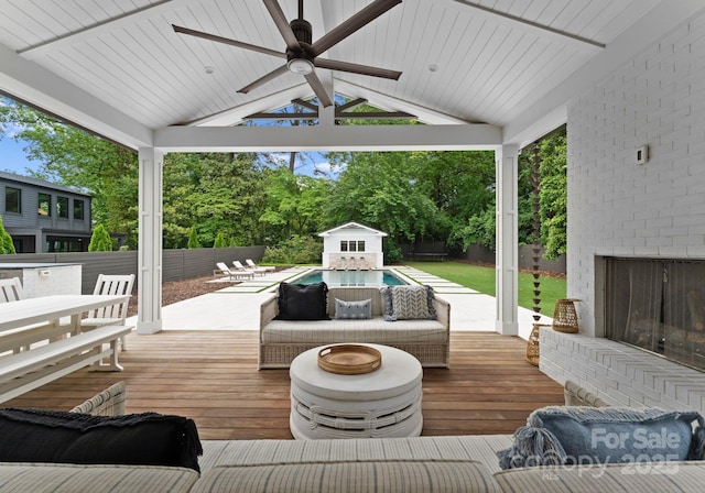 400 Hunter Ln, Charlotte, NC 28211 - wooden terrace featuring a ceiling fan, an outdoor living space with a fireplace, and outdoor dining space