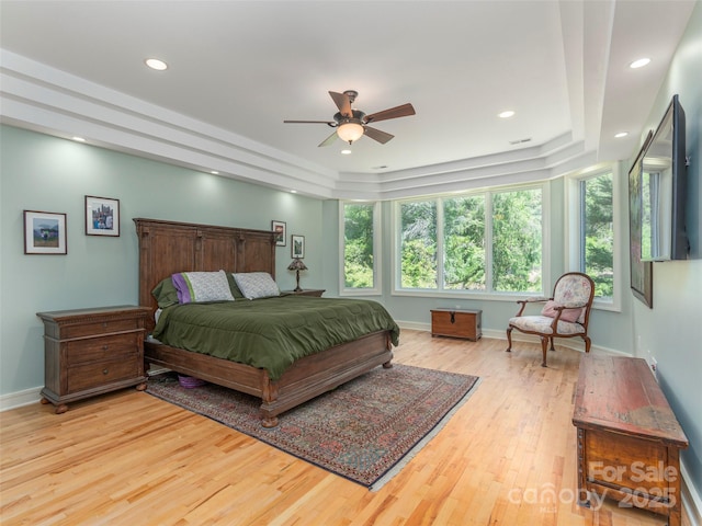 bedroom with ceiling fan, recessed lighting, baseboards, and wood finished floors