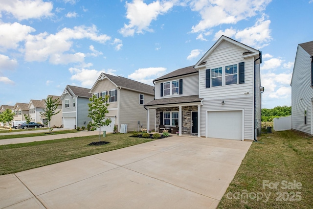 view of front of house with a front yard, a residential view, covered porch, and driveway