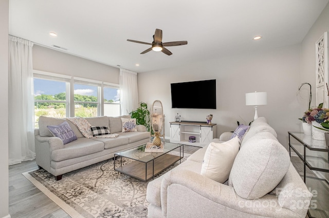 living room featuring visible vents, wood finished floors, ceiling fan, and recessed lighting