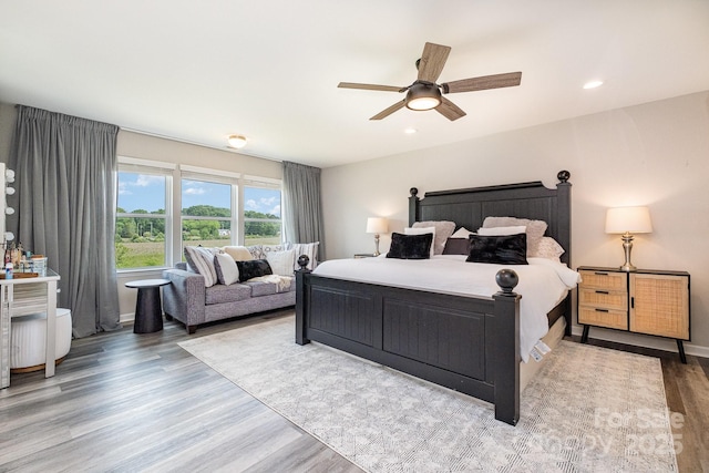 bedroom featuring recessed lighting, a ceiling fan, and wood finished floors