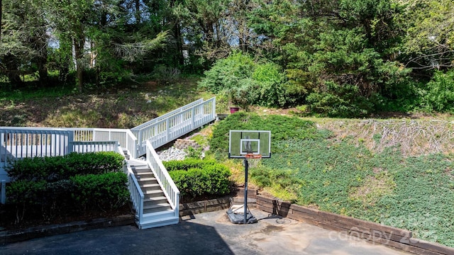 view of basketball court featuring stairway