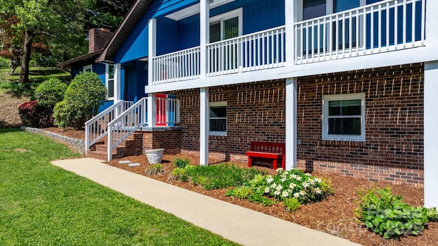 exterior space featuring brick siding and a chimney